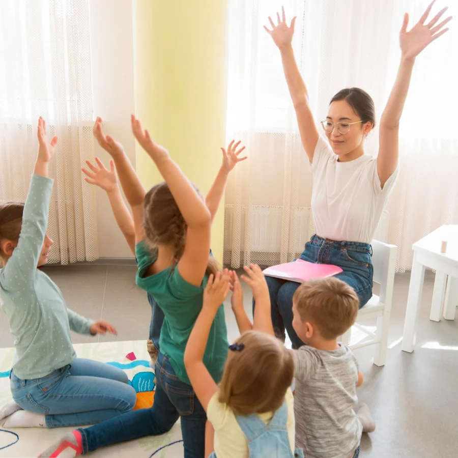 Children and a caregiver sharing a joyful group activity